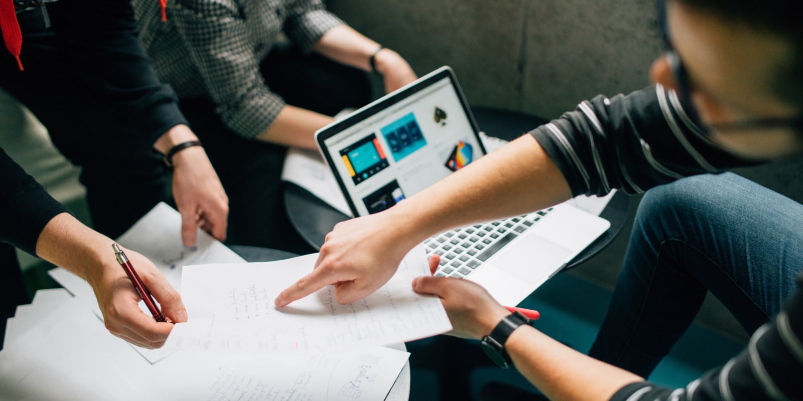 Business executives doing research on which marketing firm to work with