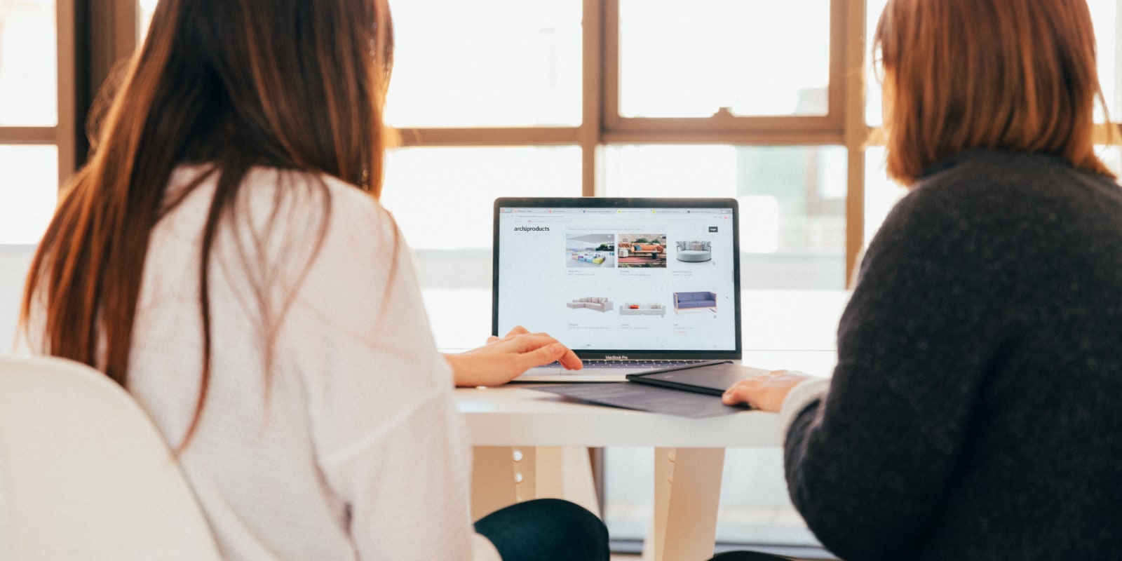 Coworkers collaborating on a digital marketing project